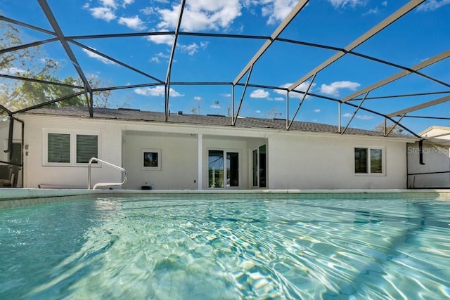 outdoor pool with a patio and a lanai