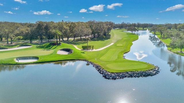 view of community with a water view and golf course view