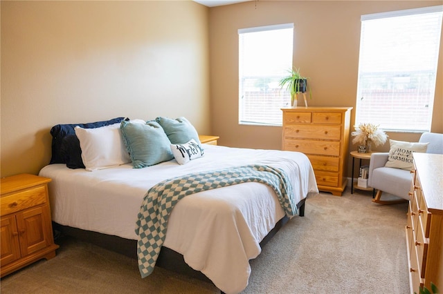 bedroom with light carpet