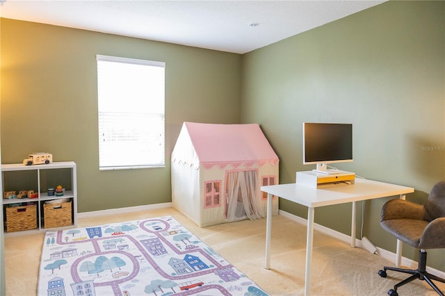 playroom with carpet flooring, a healthy amount of sunlight, and baseboards