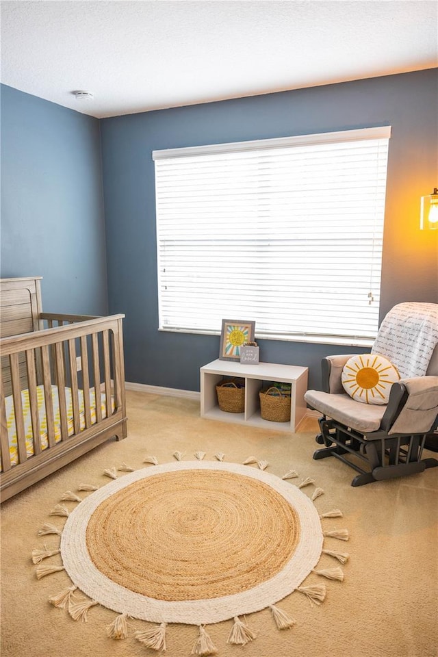 carpeted bedroom with baseboards and a textured ceiling