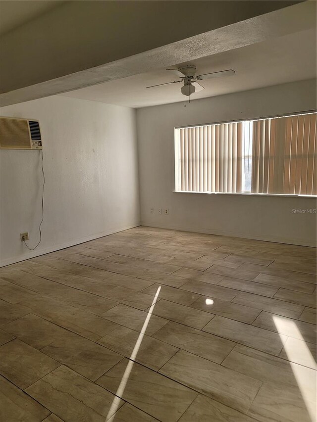 1616 Ferndell Rd, Orlando, FL 32808 - spare room with a wall mounted AC and a ceiling fan