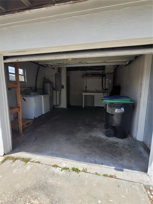 1616 Ferndell Rd, Orlando, FL 32808 - garage featuring electric water heater, washer and dryer, and electric panel