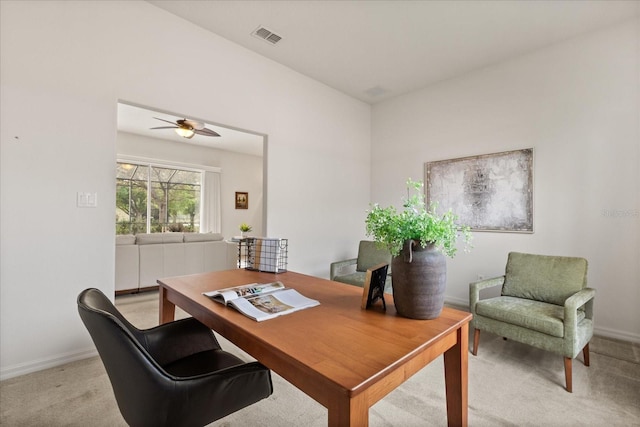 office featuring baseboards, visible vents, and light colored carpet