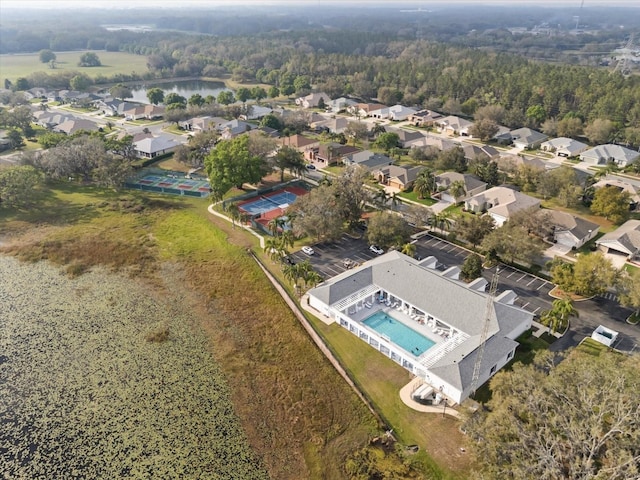 birds eye view of property with a water view and a residential view