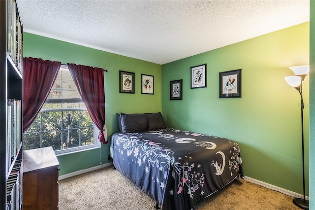 bedroom featuring carpet floors, a textured ceiling, and baseboards