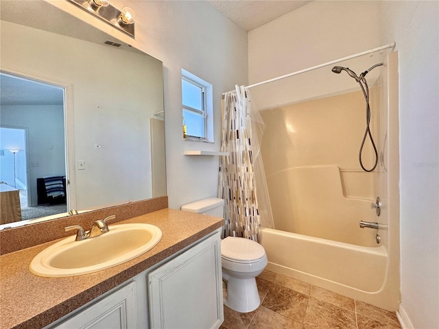 full bathroom with visible vents, toilet, shower / bath combo with shower curtain, a textured ceiling, and vanity