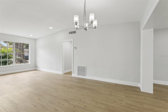 unfurnished dining area featuring light wood-type flooring, baseboards, and visible vents