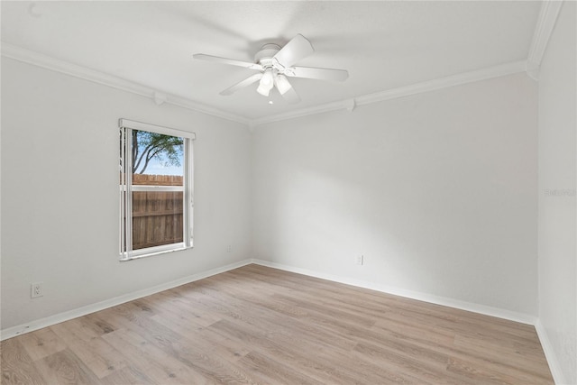 unfurnished room featuring light wood-type flooring, crown molding, baseboards, and ceiling fan