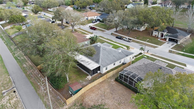 birds eye view of property with a residential view