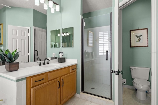 full bath with toilet, vanity, a shower stall, a textured ceiling, and tile patterned floors