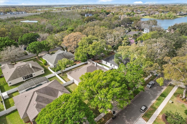 drone / aerial view with a water view and a residential view