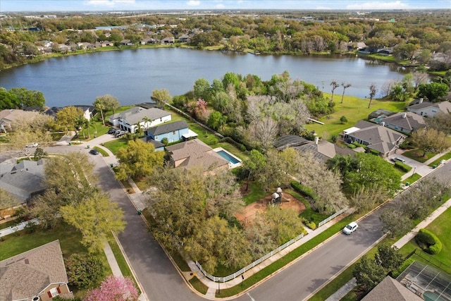 birds eye view of property featuring a water view and a residential view