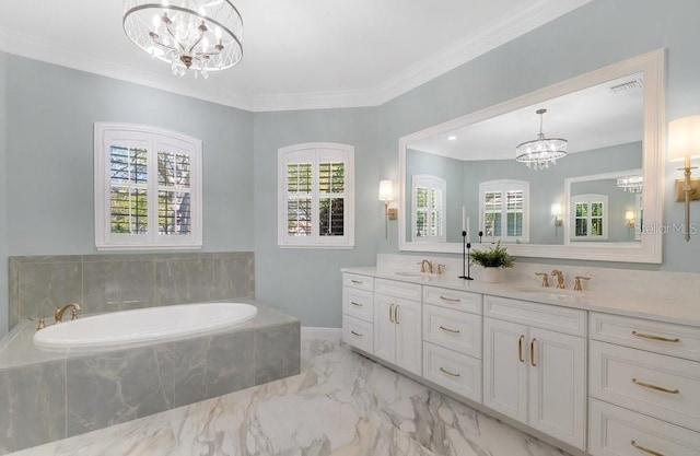 bathroom with a sink, ornamental molding, marble finish floor, and a chandelier