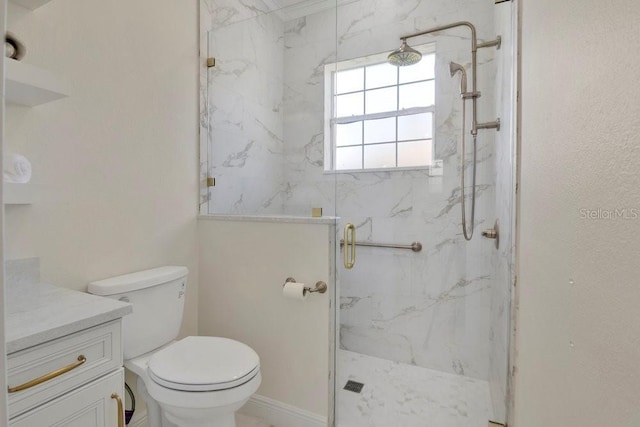 full bathroom with a marble finish shower, toilet, and vanity