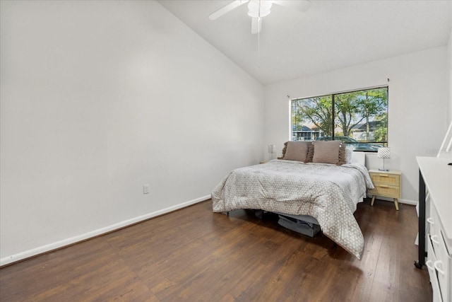 bedroom with high vaulted ceiling, a ceiling fan, baseboards, and dark wood-style flooring