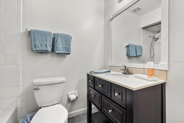 bathroom featuring toilet, baseboards, visible vents, and vanity