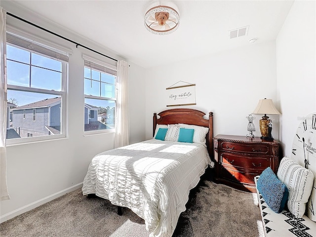 bedroom featuring carpet, visible vents, and baseboards