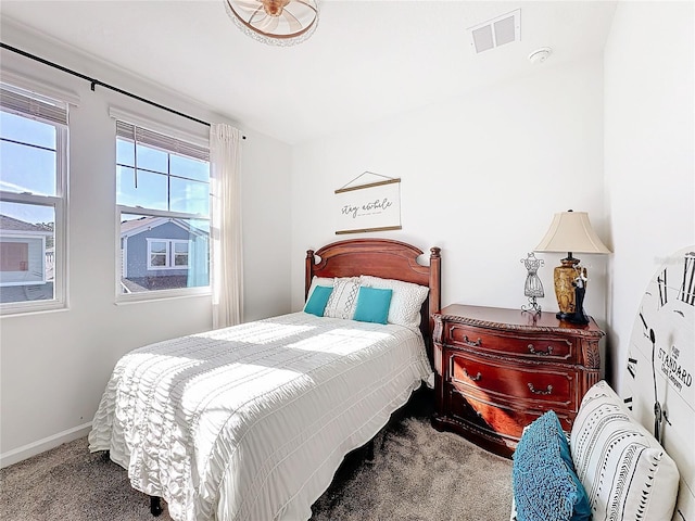 bedroom with carpet flooring, visible vents, and baseboards