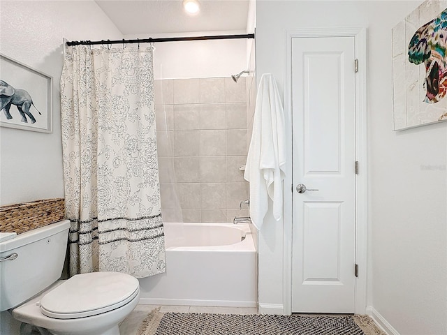 full bathroom with tile patterned flooring, shower / bath combination with curtain, and toilet