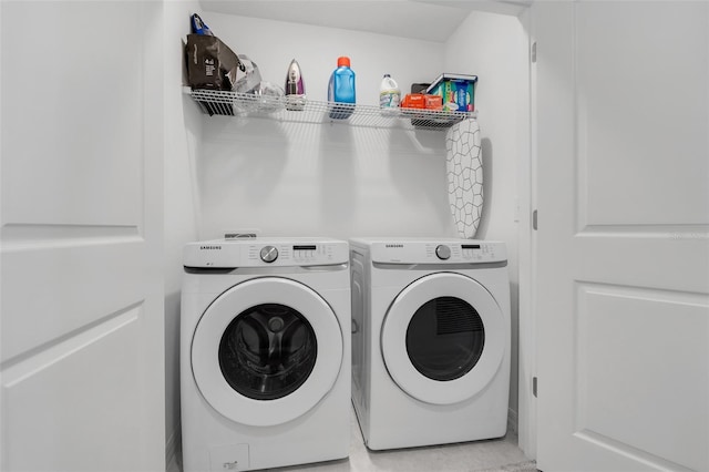 laundry room with washing machine and dryer and laundry area