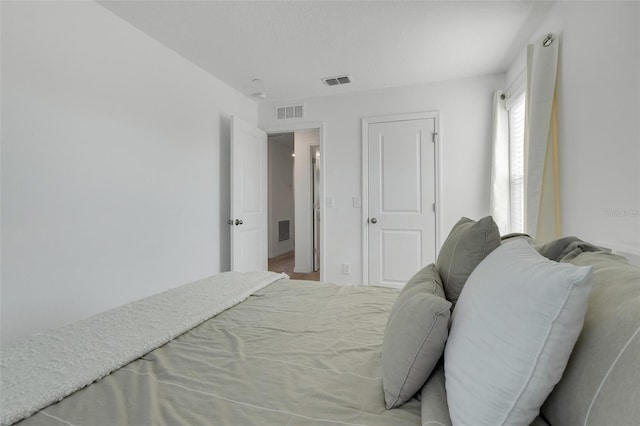 bedroom with visible vents