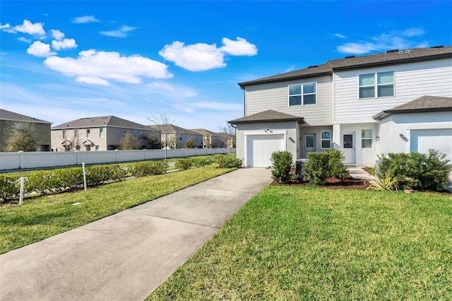 view of front of home with concrete driveway, a front lawn, fence, and a residential view