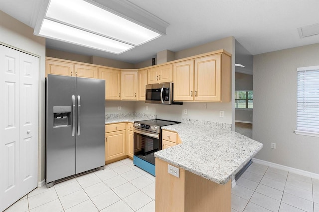 kitchen with light stone counters, light tile patterned flooring, light brown cabinets, a peninsula, and appliances with stainless steel finishes