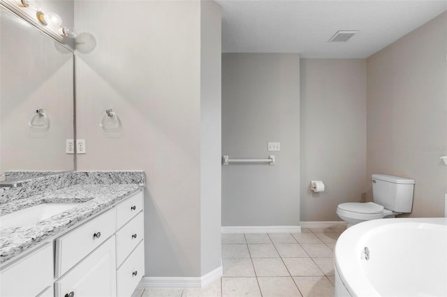 bathroom with visible vents, vanity, tile patterned flooring, baseboards, and a bath