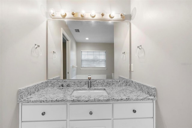 bathroom featuring visible vents and vanity