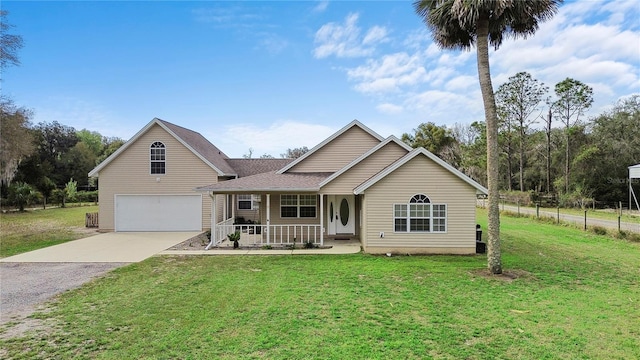 view of front of house featuring a front yard, covered porch, fence, and concrete driveway