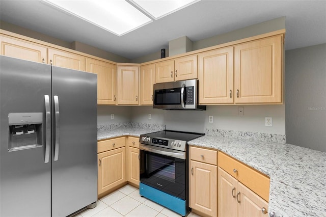 kitchen featuring stainless steel appliances, light stone countertops, light tile patterned flooring, and light brown cabinetry