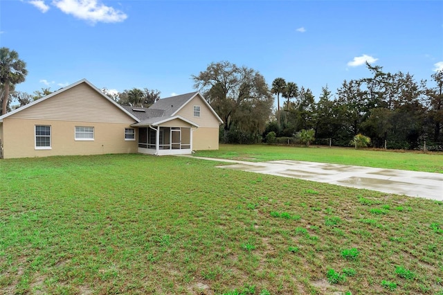 view of yard featuring a sunroom