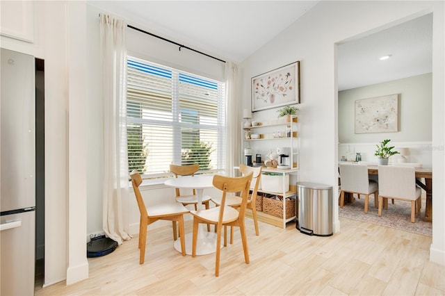 dining room with light wood-style flooring