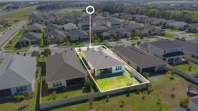 aerial view with a residential view and a water view