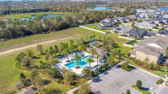 birds eye view of property with a residential view and a water view