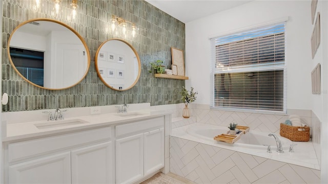 full bathroom with a garden tub, double vanity, tile walls, and a sink