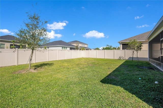 view of yard featuring a fenced backyard