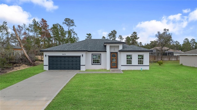 view of front of house with an attached garage, a shingled roof, concrete driveway, stucco siding, and a front yard