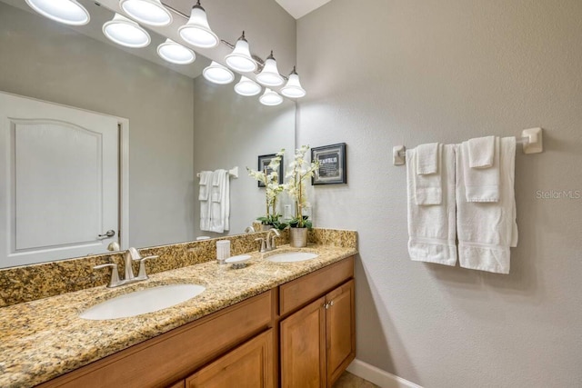 bathroom with double vanity and a sink