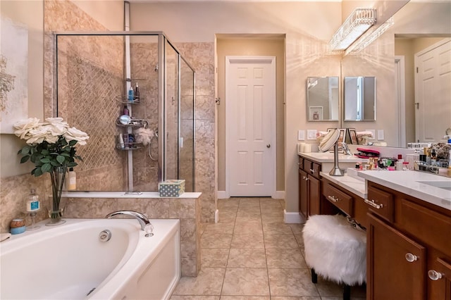 bathroom with vanity, a shower stall, a bath, and tile patterned floors