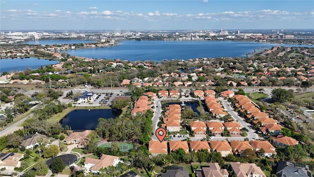 bird's eye view with a water view and a residential view