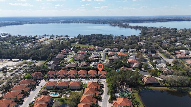 birds eye view of property with a residential view and a water view