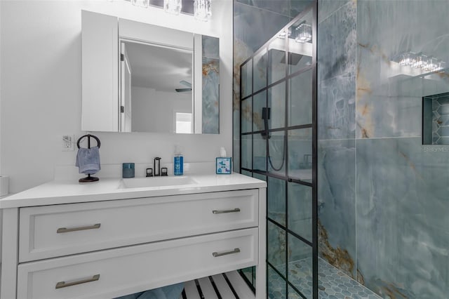 bathroom featuring walk in shower and vanity