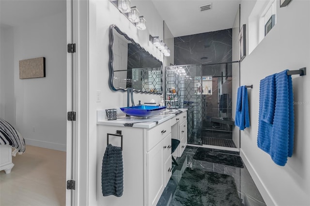 full bath featuring vanity, visible vents, baseboards, marble finish floor, and a shower stall