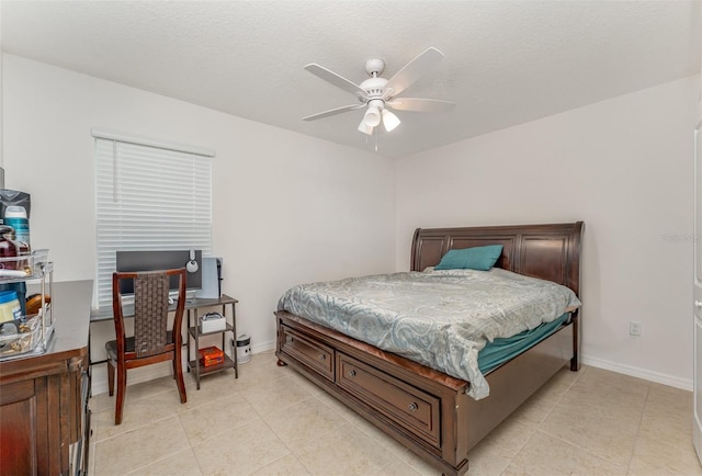 bedroom with light tile patterned floors, ceiling fan, and baseboards