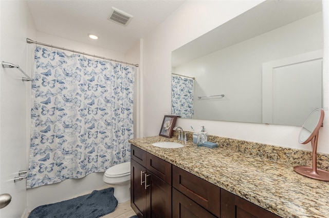 bathroom featuring curtained shower, visible vents, toilet, vanity, and tile patterned floors