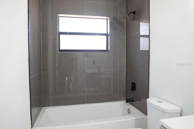 bathroom with shower / washtub combination, vanity, and toilet