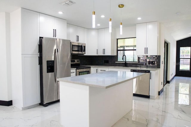 kitchen with marble finish floor, stainless steel appliances, a sink, and visible vents