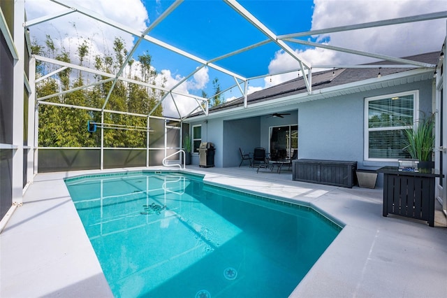 pool featuring a lanai and a patio area